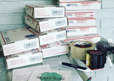 Care packages stacked with shipping supplies